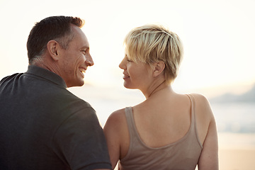 Image showing Couple, smile and beach relax at sunset in summer on tropical island for paradise, marriage or stress relief. Man, woman and evening in California together for ocean view or travel, peace or date