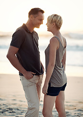 Image showing Couple, love and happy on beach with bonding for honeymoon date and weekend holiday in Seychelles. Face, man and woman with relationship, smile and care on sea sand for vacation, travel and adventure