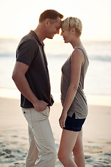 Image showing Couple, love and smile on beach with bonding for honeymoon date and weekend holiday in Seychelles. Relax, man and woman with relationship, happy and care on sea sand for vacation, travel or adventure