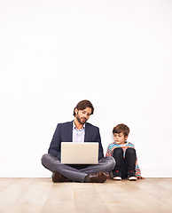 Image showing Businessman, son and relax on floor with laptop for remote work with video streaming, online games or movies in home. Family, father or kid with technology on ground for bonding, communication or fun