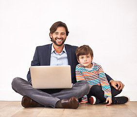 Image showing Happy father, child and portrait with laptop on floor for learning, online education and bonding with boy at home. Kid, smile and dad on computer for internet, love and connection of family together