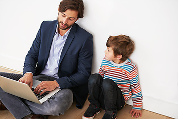 Image showing Father, son and relax on floor with laptop for remote work with video streaming, online games and movies in home. Family, parent and child with technology on ground for bonding, communication and fun