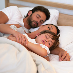 Image showing Parents, boy and sleeping in bed, home and embrace for rest, peace and quiet in family home. Father, mother and child in bedroom with blanket for fatigue, burnout and exhausted in night at house