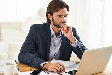 Image showing Office, laptop and businessman reading, thinking and research notes for financial analyst at desk. Consultant, business advisor or professional man checking report, email and planning startup ideas.