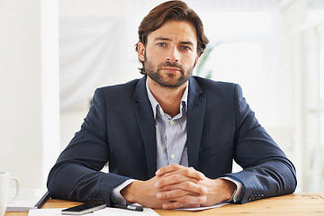 Image showing Desk, confidence and portrait of serious businessman with pride, paperwork and serious financial analyst in office. Consultant, business advisor or man with pride, documents and notes at startup.