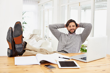 Image showing Businessman, relax and smile with computer at house for remote, freelance work and internet research. Male person, hands and feet on desk for wellness and technology in home office for online job