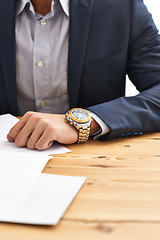 Image showing Man, hand and wristwatch on desk with paperwork for information, notes and deadline for task. Closeup, business and suit with time for schedule on appointment to report, update and give feedback.