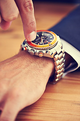 Image showing Hands, table and wristwatch with pointing time for deadline at office, table and schedule for business. Closeup, check and appointment for work with commitment, punctual and plan for meeting