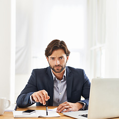 Image showing Angry, businessman and portrait in office with report on desk and serious problem in paperwork, review and feedback. Frustrated, entrepreneur and reading a mistake, error and notes on document