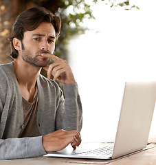 Image showing Businessman, laptop and thinking of planning outdoor with remote work, relaxing or freelance writer. Entrepreneur, person and face or technology for reading, typing or online research in nature