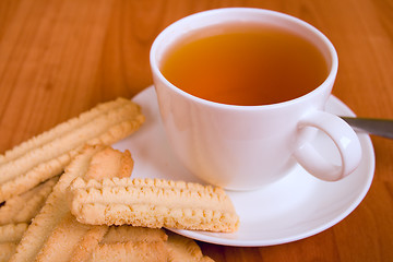 Image showing cup of tea and some cookies