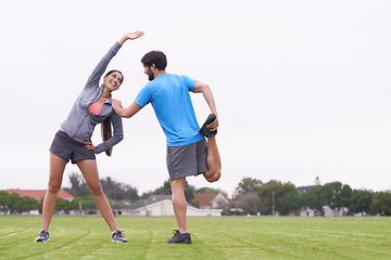 Image showing Happy couple, fitness and stretching together on field for outdoor workout or exercise in nature. Active, young man and woman in body warm up for team training, health and wellness on mockup space