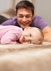Image showing Family, father and toddler, happy playing together for bonding and development with love and care. Man with baby, playful and games with safety and security, parenting and childhood with fun at home