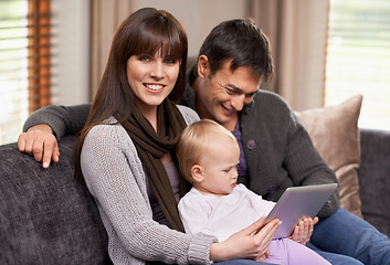 Image showing Digital, tablet or baby with parents on a sofa for cartoon, streaming or videos while bonding at home. Search, learning and family in living room with storytelling app, fantasy or child development