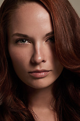 Image showing Woman, portrait and cosmetics for haircare in studio, attitude and keratin treatment or shampoo. Female person, serious face and beauty in hairstyle, aesthetic and closeup of dermatology and growth