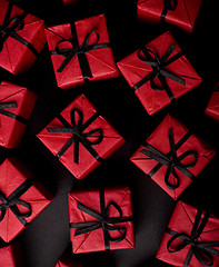 Image showing red gift boxes on black