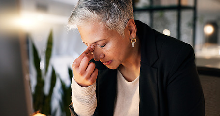 Image showing Business, night and senior woman with headache, stress and frustrated with pain and overworked. Mature person, employee and evening with entrepreneur and migraine with health crisis, ache and burnout