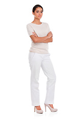 Image showing Fashion, serious woman and portrait with arms crossed in studio for confidence, attitude or style on white background. Clothes, pride or female model posing in trendy, cool or neutral outfit choice
