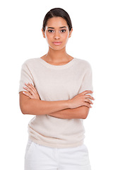 Image showing Portrait, fashion and serious woman with arms crossed in studio with confidence, attitude or style on white background. Clothes, pride or female model posing in trendy, cool or neutral outfit choice