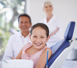 Image showing Portrait, dentist and man with kid in clinic for expert advice, confidence and orthodontics in medical health. Dental medicine, healthcare and professional with girl patient, smile and oral service