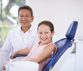 Image showing Portrait, dentist and man with child in clinic for expert advice, confidence and orthodontics in medical health. Dental medicine, healthcare and professional with girl patient, smile and oral service