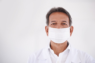 Image showing Portrait, dentist and doctor in clinic with mask, mockup and expert advice in orthodontics for medical health. Dental medicine, healthcare and professional with pride, ppe and oral service with space