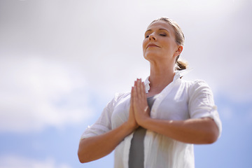 Image showing Happy woman, yoga and meditation in spiritual wellness or faith with cloudy sky background. Female person or yogi meditating or hands together for praying, hope or awareness with fresh air in nature