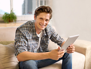 Image showing Tablet, happy and portrait of man on sofa in home for social media, networking and browse website. Relax, smile and person with digital tech for internet, connection and streaming in living room