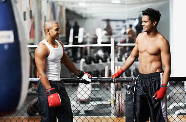 Image showing Fitness, conversation and fighter in gym with coach for training, self defense or combat training. Exercise, sports or talking with muscular man and personal trainer in preparation for boxing