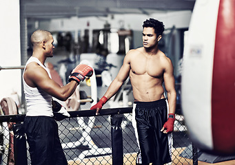 Image showing Exercise, talking and fighter in gym with coach for training, self defense or combat training. Fitness, sports or boxing with shirtless man and personal trainer in preparation for competition