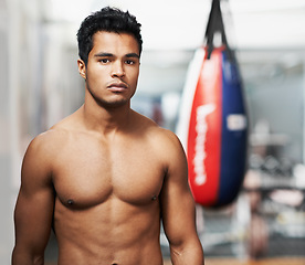 Image showing Sport, training and portrait of man in gym for exercise, practice or wellness for physical health. Personal trainer, face and serious expression with confidence for boxing, fight skill or development