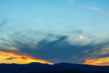 Image showing colorful sunset over the hills