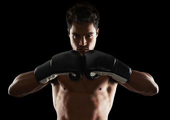 Image showing Portrait, man and boxer in stance for training, sports or workout for body health isolated on black background in studio. Fighter, serious face and athlete in gloves for fitness or exercise in Brazil