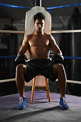 Image showing Portrait, man and boxing ring for sports, corner or training for competition in gym for body health. Fighter, athlete and serious person with gloves for fitness, exercise or workout at club in Brazil