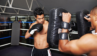 Image showing Boxer, man and coach in boxing ring for training, workout and punching bag for performance with fight and fitness. Professional, athlete and exercise for competition, match or sport with healthy body