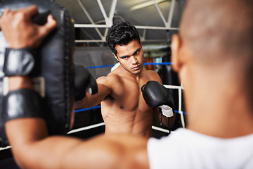 Image showing Boxer, man and coach in boxing ring with punching bag for training, workout and performance with fight or fitness. Professional, athlete and exercise for competition, match or sport with healthy body