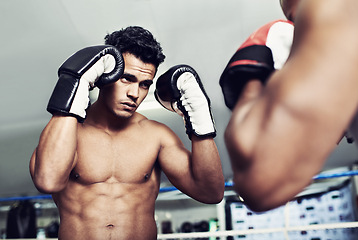 Image showing Boxer, man and fight in boxing ring for workout, training and confidence for performance with coach or fitness. Professional, athlete or exercise for competition, match or sport with personal trainer