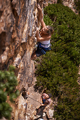 Image showing Woman, mountain and rock climbing for fitness in outdoors, challenge and rope for training. Female person, cliff and extreme sport for exercise or workout, high angle and support to explore in nature