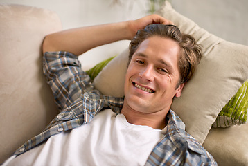 Image showing Man, portrait and relax on sofa in home or comfortable on weekend for lazy vacation, resting or living room. Male person, face and couch in apartment for holiday morning in London, happy or peace