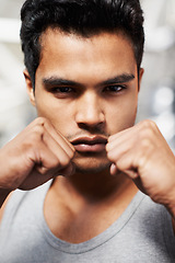 Image showing Man, portrait and boxing with confidence, closeup and fists ready to punch in match for training and exercise. Male person, workout and focus in gym, mma and boxer for sports and combat for defence