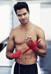Image showing Athlete, portrait and smile for MMA in gym for training, wellness and sport with workout for body. Man, exercise and wraps on hands, muscle and health for person in fitness centre and strong