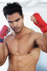 Image showing Portrait, man and boxer in club for sports, training and workout for healthy body. Fighter, face and serious athlete with muscle on abs for fitness, exercise and martial arts at a gym in Brazil