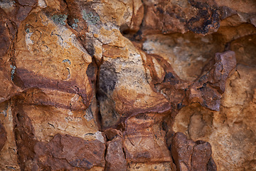 Image showing Rock face, closeup and mountain in nature, natural or travel outdoor with wall. Cliff, stone and environment for bouldering, climbing and texture of surface in summer on a background in South Africa