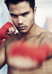 Image showing Gym, portrait and boxing fitness man with punch power, training or body performance, challenge or focus. Hands, mindset or guy fighter with fist wrap for sports battle, action or martial arts warrior