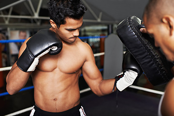 Image showing Fitness, sports and fighter in gym with coach for training, self defense or combat training. Exercise, workout or boxing with shirtless man and personal trainer in preparation for competition