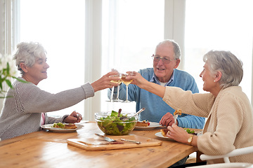 Image showing Wine, cheers and senior friends at brunch in home with smile, celebration and bonding in retirement. Food, drinks and toast with glass, old man and women at dinner table together for happy lunch.