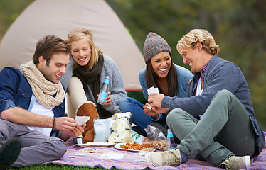 Image showing Nature, camping and friends on picnic with food laughing, talking and bonding on vacation. Happy, travel and group of people eating lunch in outdoor field, park or forest on holiday or weekend trip.