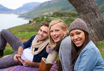 Image showing Nature, smile and portrait of friends on picnic laughing and bonding on vacation or adventure. Happy, travel and group of people relaxing in outdoor field, park or forest on holiday or weekend trip.