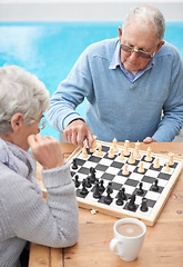 Image showing Chess, relax and old couple thinking while playing a board game in backyard or bonding together. Mind, problem solving or challenge with an elderly man or senior woman in the garden for competition
