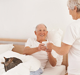 Image showing Senior couple, serving and coffee in bed, smile and relaxing together in retirement at home. Elderly people, bedroom and drinking tea in marriage or relationship, cat and bonding for love on weekend